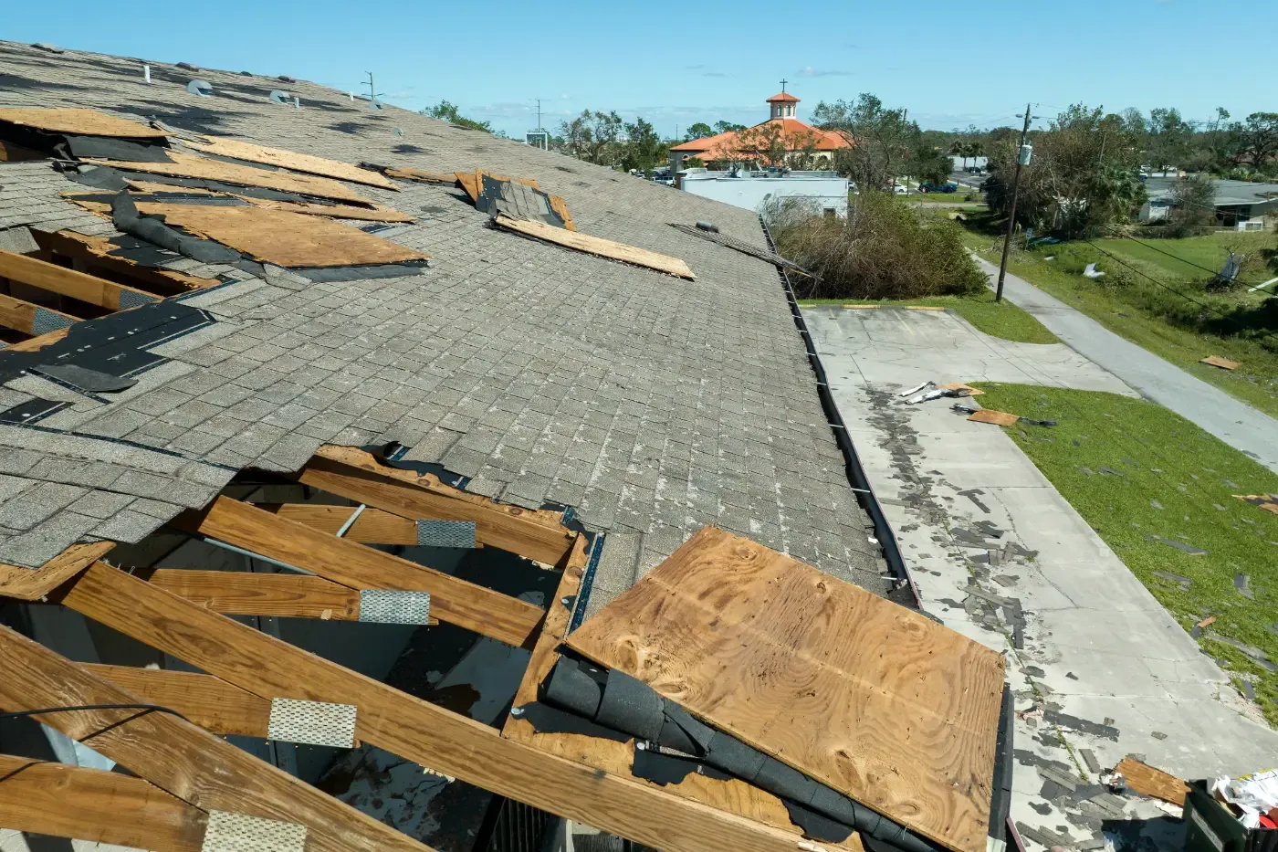 Damaged townhouse roof after hurricane in houston